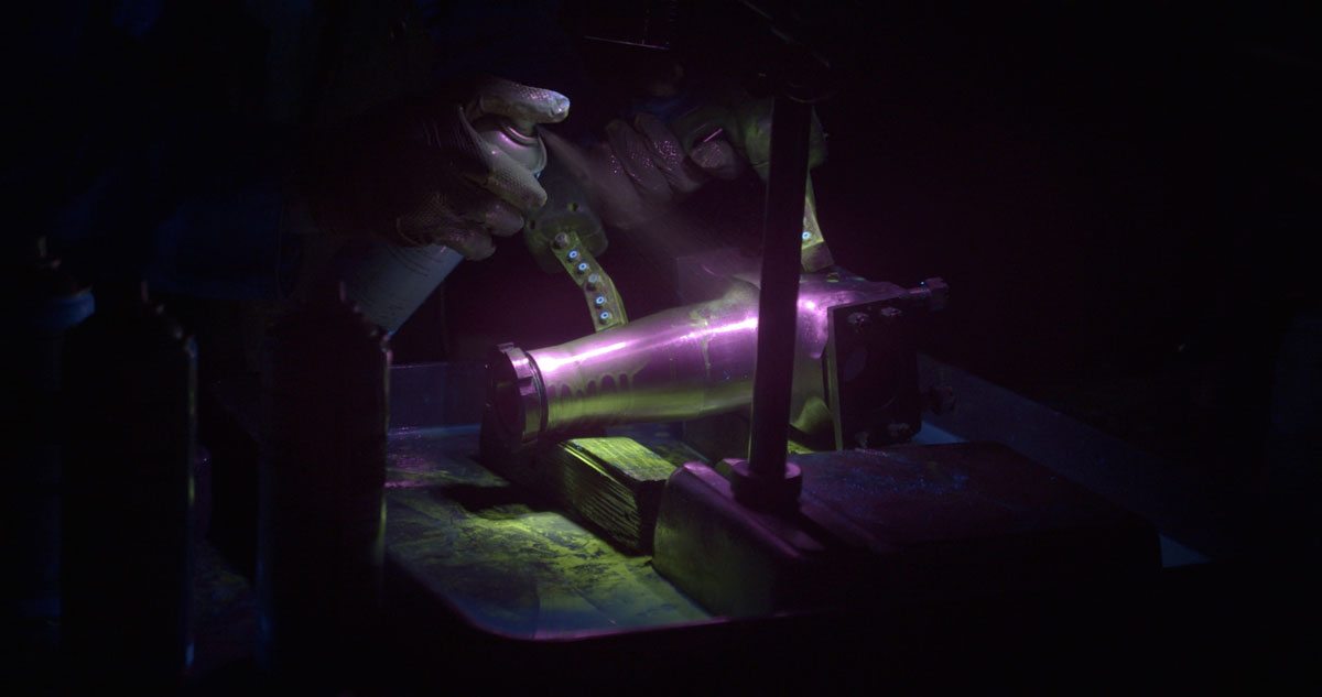 Crack testing with Ultra Violet fluorescent light on the engine subframe of Sunbeam 1000Hp